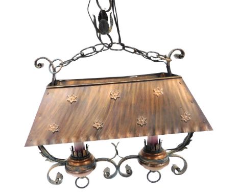 A late 20thC copper and cast iron two branch ceiling light, with a copper hood, 45cm wide.