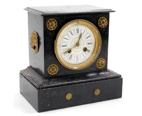 A late 19thC slate cased mantel clock, circular brass dial, with enamel chapter ring bearing Roman numerals, eight day moveme