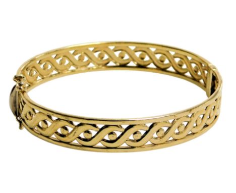 A Clogau Welsh 9ct gold bangle, in an open work S and ball design, on a snap clasp, with certificate, 19.2g. 