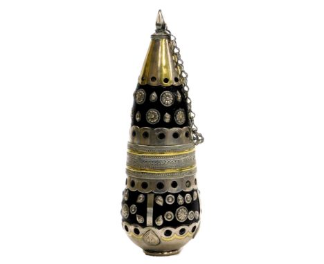 An early 20thC Turkoman gun powder flask, with white and yellow metal mounts and rosettes, with chain, 16.5cm high.