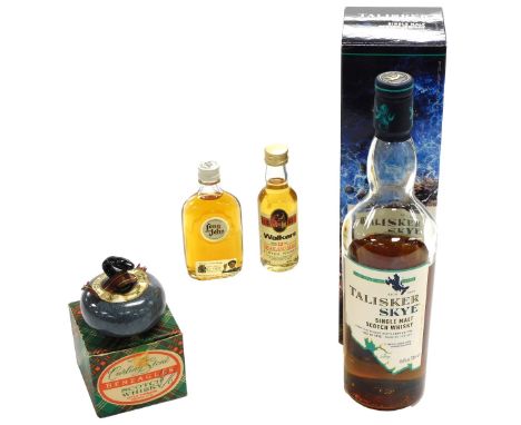 A bottle of Talisker Skye Single Malt Scotch whisky, 70cl, boxed, together with a Ben Eagles Scotch whisky curling stone, and
