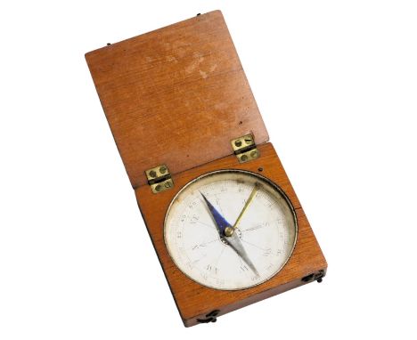 An early 20thC mahogany cased pocket compass, 7cm wide. 