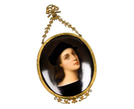 A late 19thC Continental porcelain plaque after Raphael, self portrait, in an oval brass frame, with bow and swag suspension,