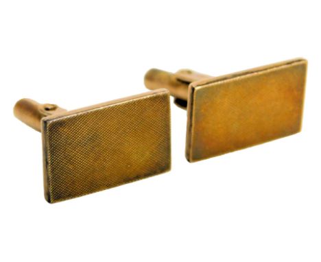 A pair of gentleman's cufflinks, the rectangular table with engine turned decoration, stamped 14k, 9.5g. 