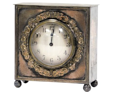 An early 20thC silver plated cased mantel clock, with a silvered dial, chapter ring bearing Arabic numerals, Buren clockwork 