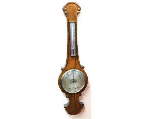 A 19thC oak cased wheel barometer, stamped from The Royal Exchange destroyed by fire on the 9/16th January 1836, 98cm high.