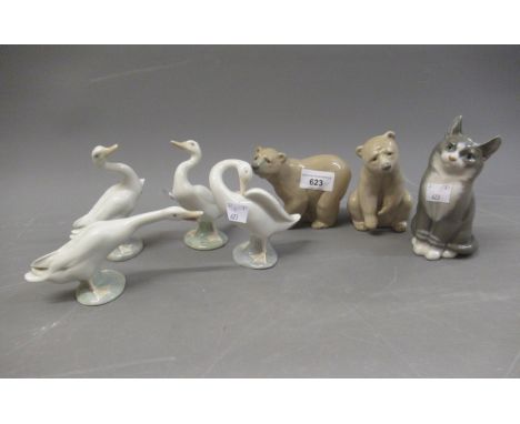 Royal Copenhagen figure of a seated cat, two Lladro figures of bears and four Lladro figures of geese 