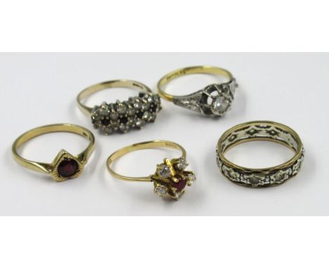 Two 18ct gold dress rings, 4.8g together with two 9ct gold dress rings, 4.2g and an eternity ring 