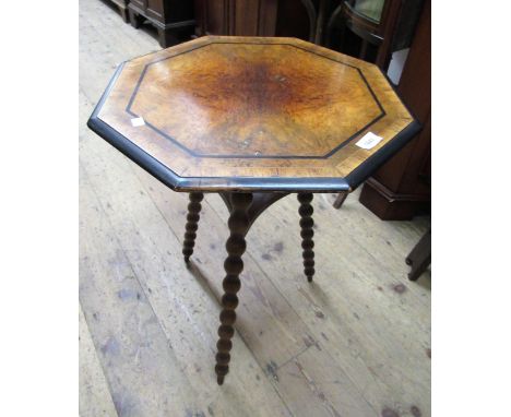 Victorian figured walnut octagonal occasional table on three bobbin turned supports, 50cms diameter 