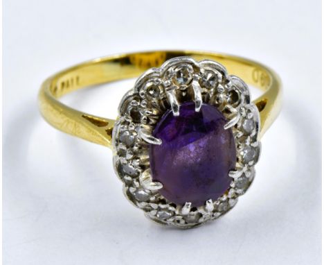 18ct Yellow gold and platinum cluster ring, set oval amethyst bordered by diamonds 