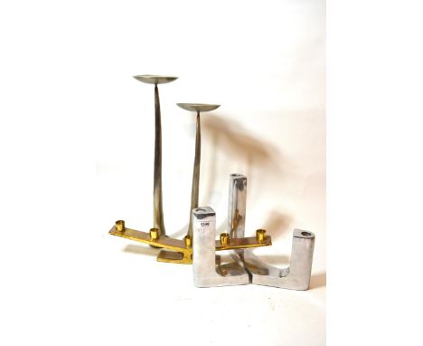 Two pairs of modern metal candle stands of stylised design and a brass five light candelabra 