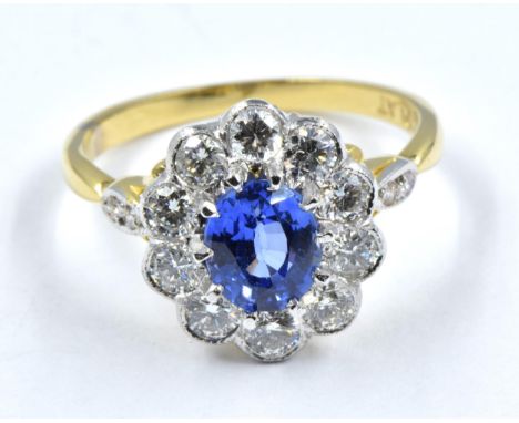 18ct yellow gold and platinum ring set with central oval sapphire surrounded by diamonds, size 'O' 