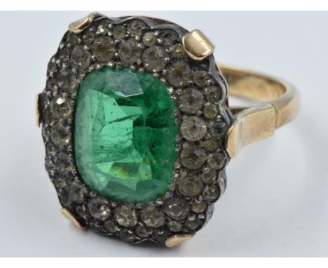 Large 9ct gold dress ring, set with green and white paste stones8.8g in weight 