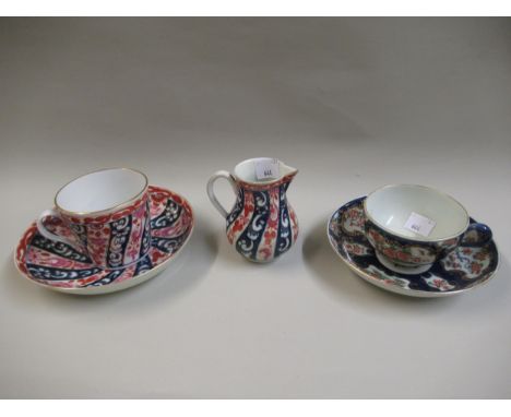 Worcester Dr Wall teacup and saucer decorated with panels of flowers on a blue and gilt ground, together with another Worcest