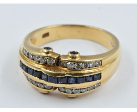 18ct Gold ring set a band of sapphires flanked by diamonds, 6g, size N 