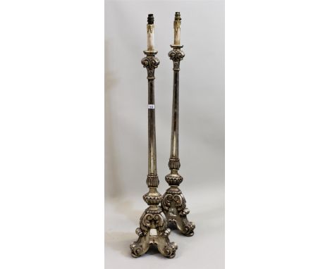 Pair of silvered and mirror inset lamp standards, with triform bases in 17th Century Dutch style, 119cms high (excluding the 