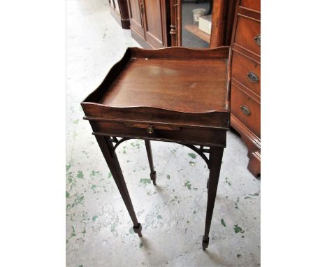 Small reproduction mahogany kettle stand, the galleried top above a pull-out slide on slender square tapering supports, 64cms