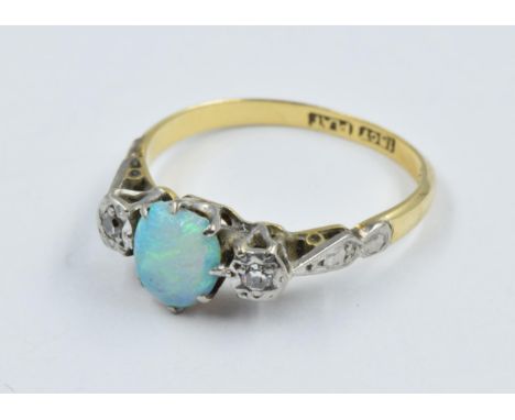 18ct Gold ring set oval opal, flanked by two diamonds, size J 