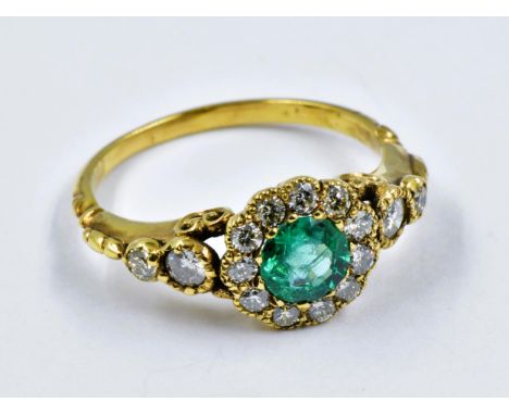 Yellow metal Victorian style emerald and diamond cluster ring 