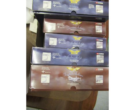 Box containing five Corgi diecast metal model aircraft in original boxesLooks to have ben displayed. Not mint, look to be com