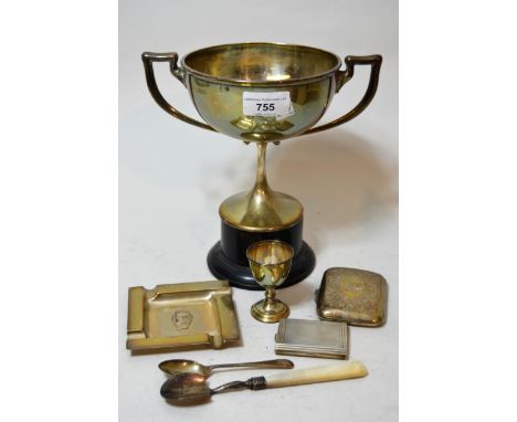 Silver two handled pedestal prophy cup, George V silver ashtray, silver cigarette case, match case, eggcup and spoon, 18 ounc