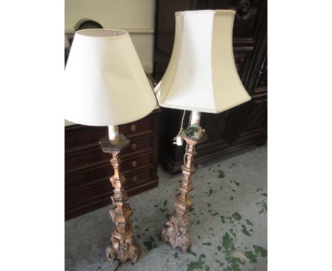 Pair of 17th / 18th Century Continental carved and giltwood candle stands, the tapering hexagonal knopped baluster stems abov