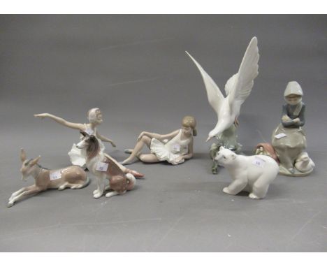 Lladro figure of a dove, another of a girl with duck and ducklings, another of a seated ballerina, three Lladro figures of an