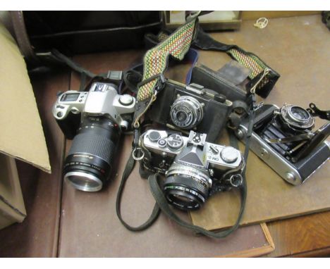 Olympus OM2 SLR camera with extra lens and accessories and a quantity of various other cameras, cases and accessories 