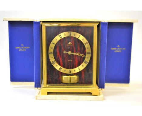 Jaeger-LeCoultre Atmos mantel clock having red dial with gilt chapter ring and Roman numerals, in original case, 22cms highHa