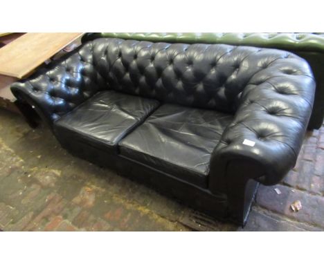 Small black button leather upholstered two seat Chesterfield settee, 185cm wide 