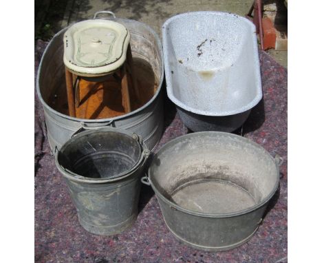 A galvanised two handled oval tin bath, three galvanised buckets of varying design, a small enamel bath and  an enamel lined 
