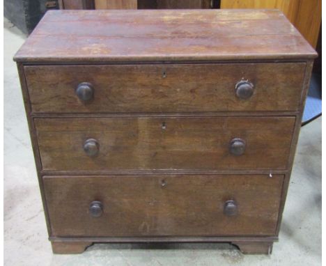 A small 19th century oak countrymade bedroom chest of three long graduated drawers raised on possibly associated bracket supp