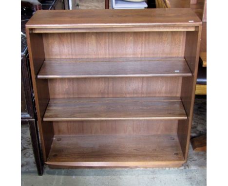 An Ercol Golden Dawn elm open bookcase with two adjustable shelves over a recessed plinth with integral castors, 3ft wide 