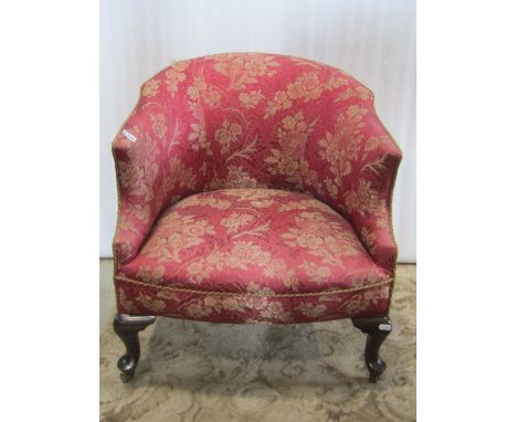 A low Edwardian tub chair with shaped outline, upholstered finish and short cabriole forelegs together with a Victorian spoon