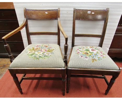 A set of seven (5+2) 19th century mahogany dining chairs with reeded bar backs over drop in floral tapestry seats, raised on 