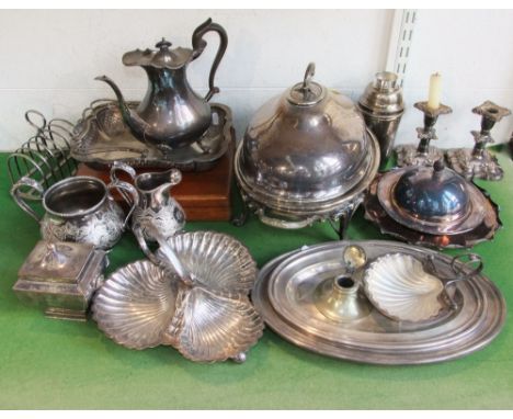 A large quantity of silver plated items to include a good quality silver plated twin handled entree dish upon four scrolled f