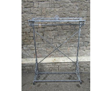 A contemporary floor standing light steel framed hall stand/clothes rail with decorative pierced scrollwork brackets