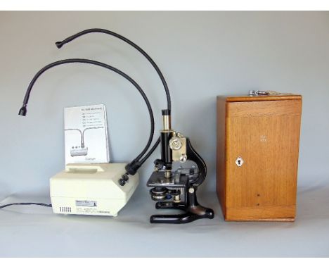 Cased Prior microscope with accessories, together with a further surgical type lamp (2)