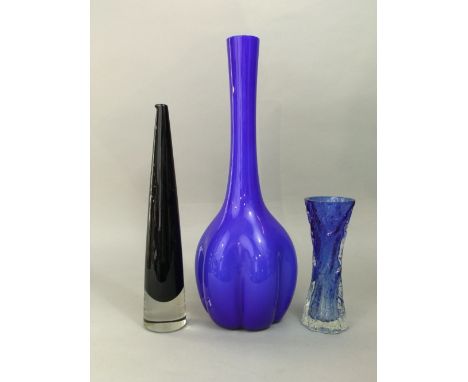 A Timo Sarpaneva art glass decanter/jug in navy blue of tapered form, 39cm high; together with a further Swedish art glass lo