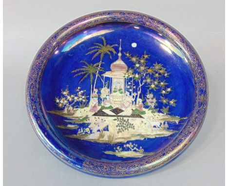 A Carltonware Persian pattern bowl of circular shallow form with rounded rim, with printed and infilled decoration on a blue 
