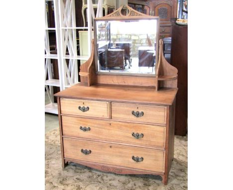 A late Victorian/Edwardian stripped mahogany dressing chest of two short and two long graduated drawers beneath a rectangular