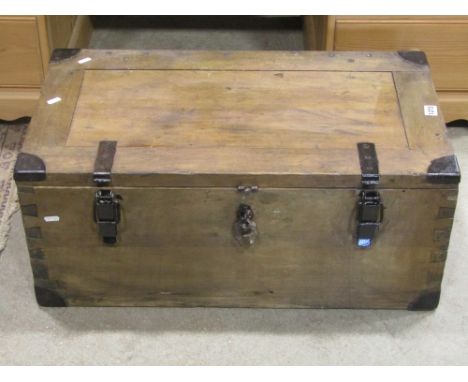 A heavy duty stripped pine box with hinged lid and side carrying handles, a Victorian tin trunk, a 19th century chimney glass