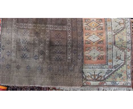 Antique village rug with various symbols upon a brown ground, 220 x 135cm, together with a further Turkish type full pile rug