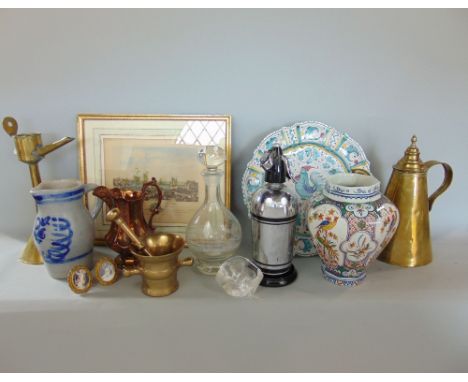 A collection of miscellaneous items to include a cast brass pestle and mortar, a further lamp and kettle, together with faien