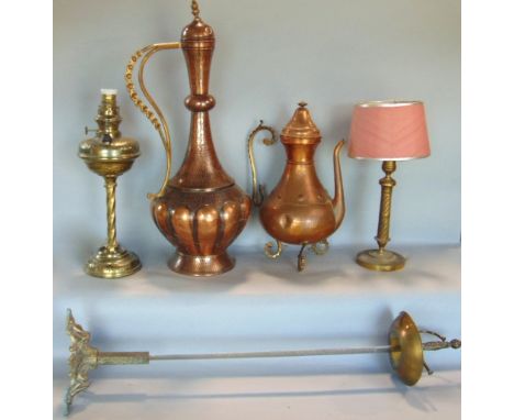 A collection of interesting metalware items to include a fencing sword and stand, two eastern copper jugs, an oil lamp and a 