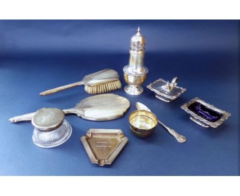 A mixed collection of silver to include a squat baluster caster, a silver lidded inkwell, a cast silver mustard and salt with