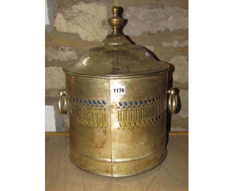 A Georgian style coal bin of cylindrical form with pierced fret work band, drop ring handles and domed lid with urn finial