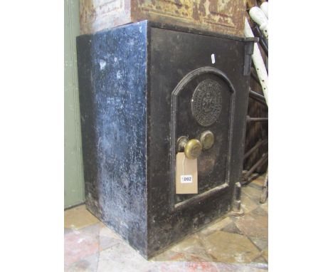 Thomas Perry &amp; Sons patent fire resisting safe, enclosed by single arched moulded panel door, with knop handle, complete 