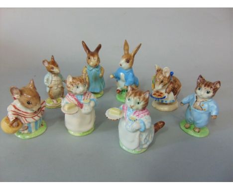 A collection of seven Beswick Beatrix Potter figures including Peter Rabbit and Mrs Flopsy Bunny, both with gold back stamps,