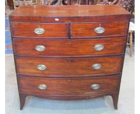 A Regency mahogany bow fronted caddy top bedroom chest of two short over three long graduated drawers with oval embossed bras